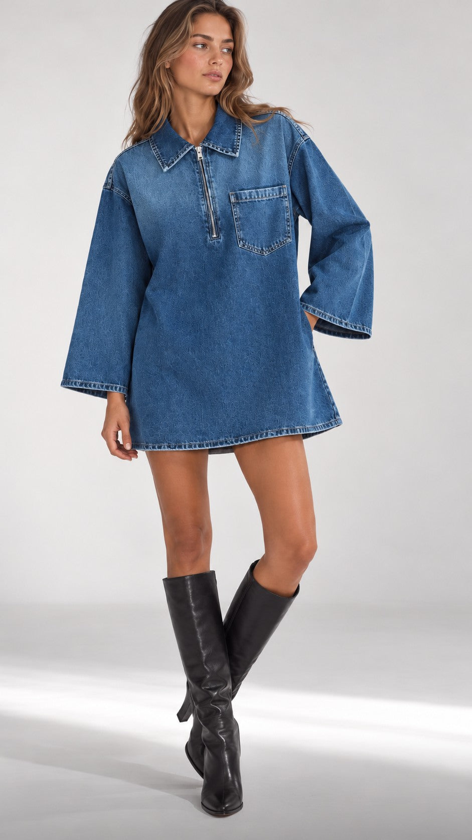 The Half-Zip Denim Dress in Dark Denim, worn with knee boots