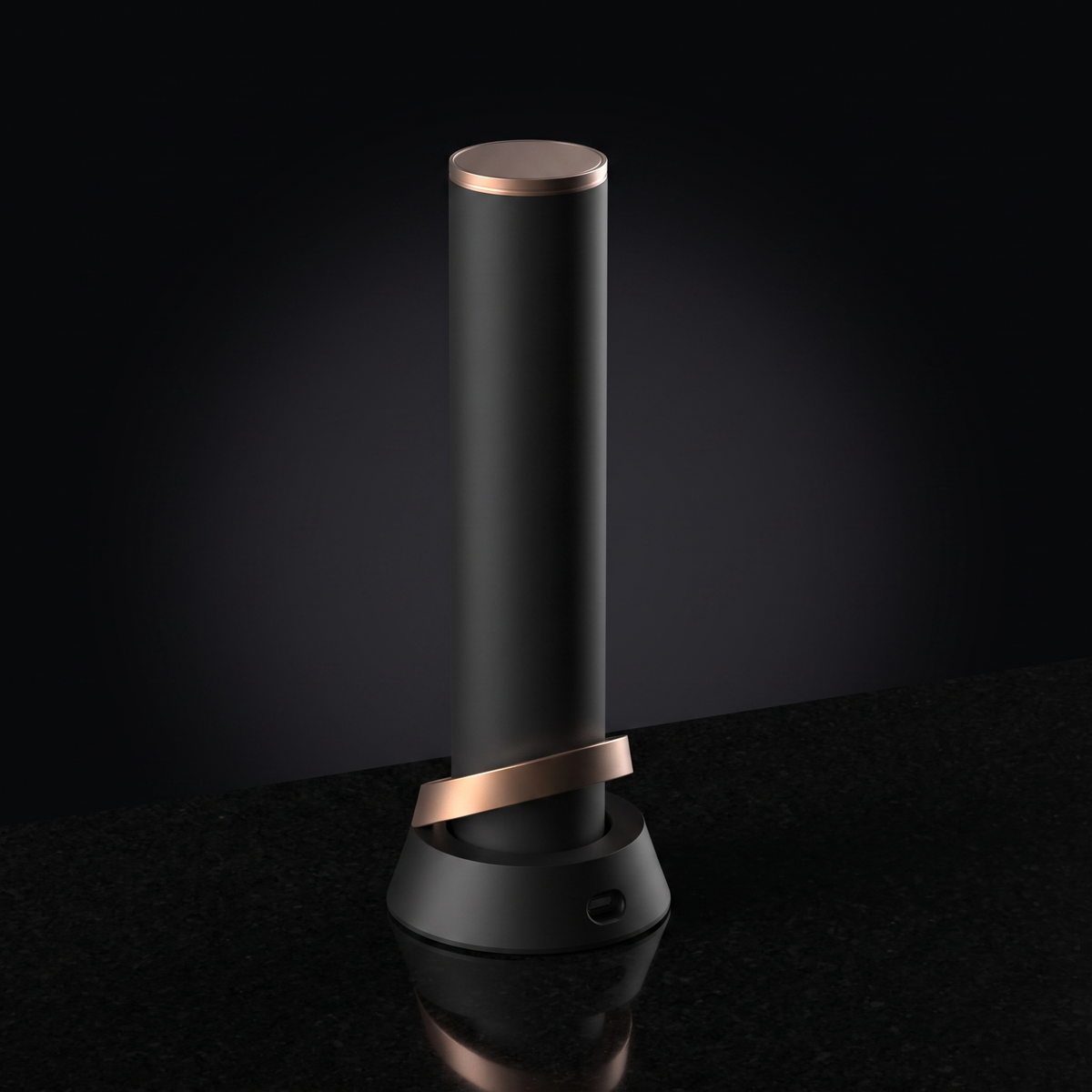 Column Electric Corkscrew in champagne gold on its charging base, studio shot on black
