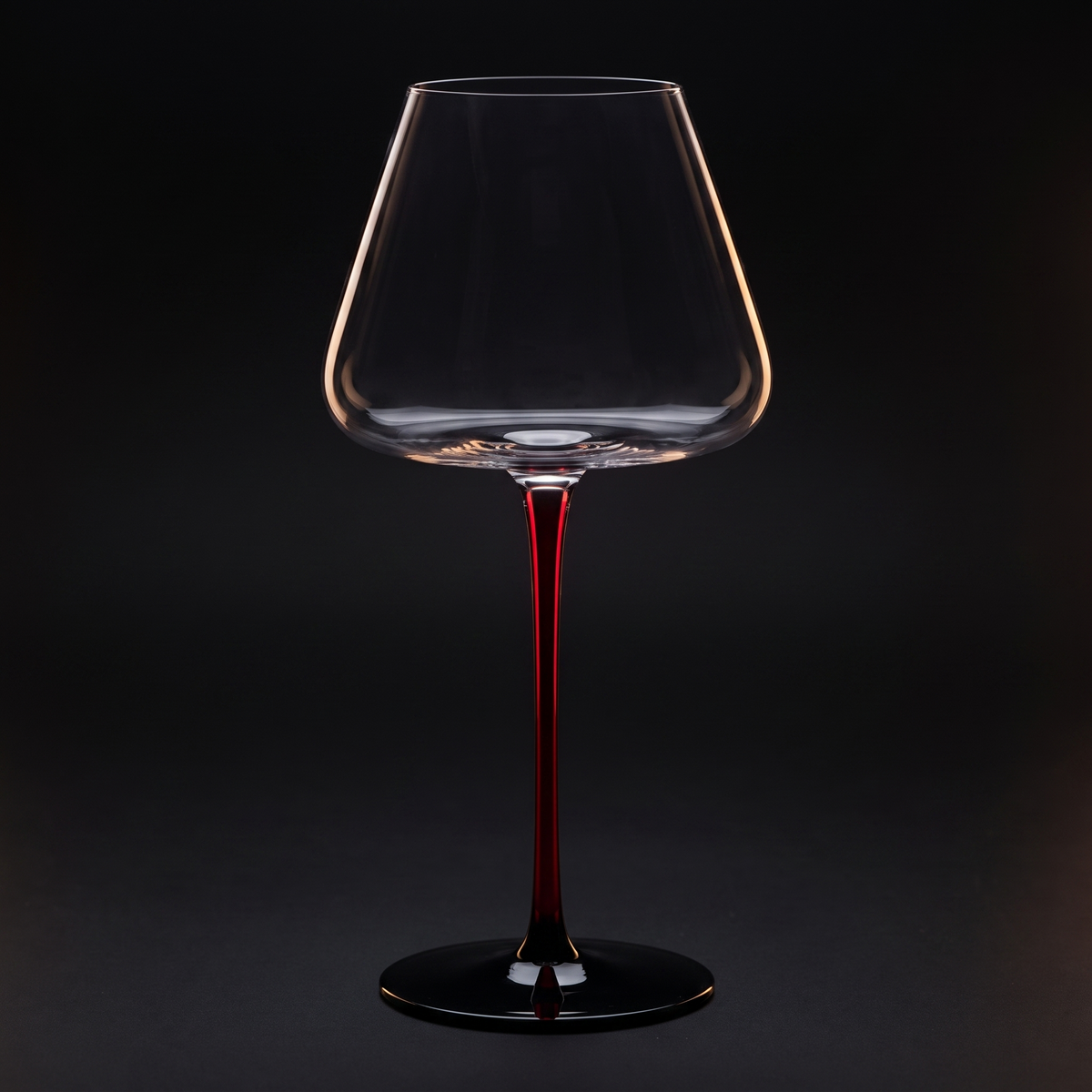 Burgundy glass on the scarlet stem, black ground