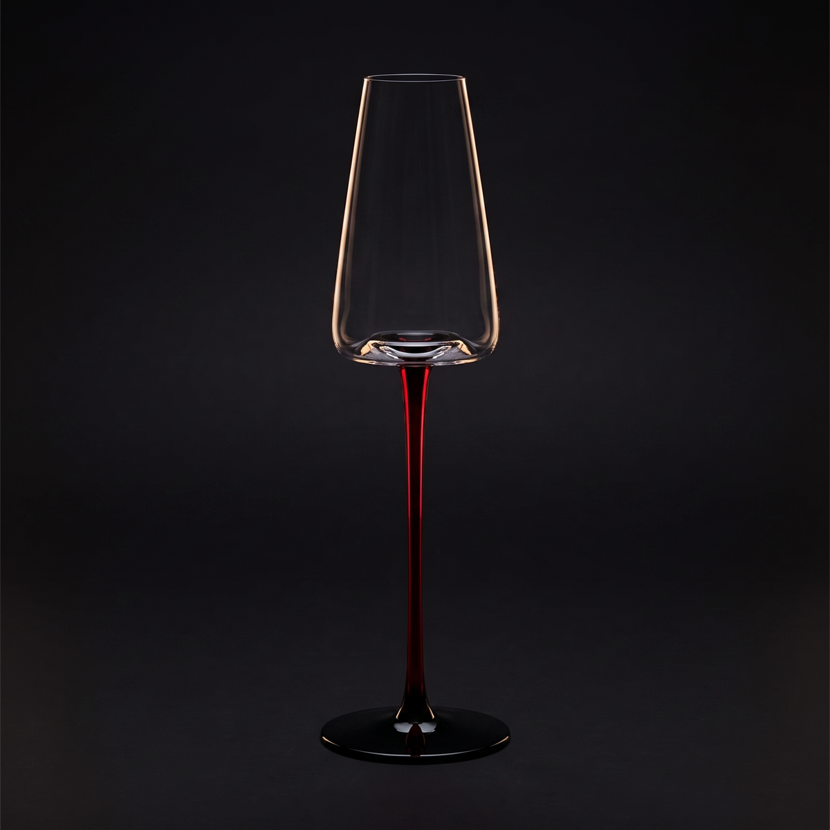 Champagne glass on the scarlet stem, black ground