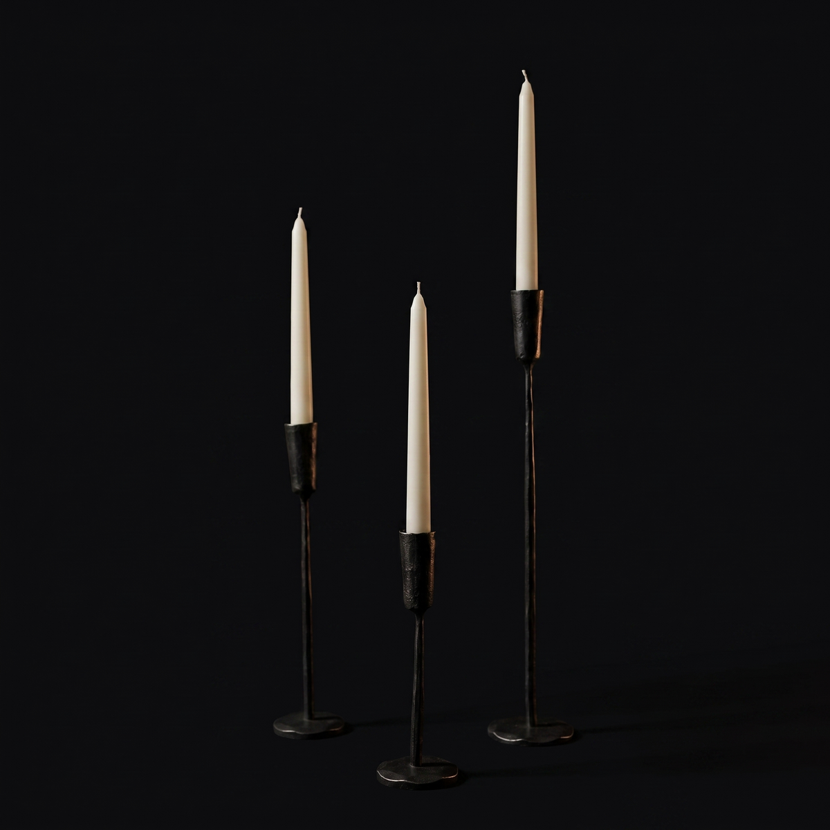 The three graduated heights with ivory tapers