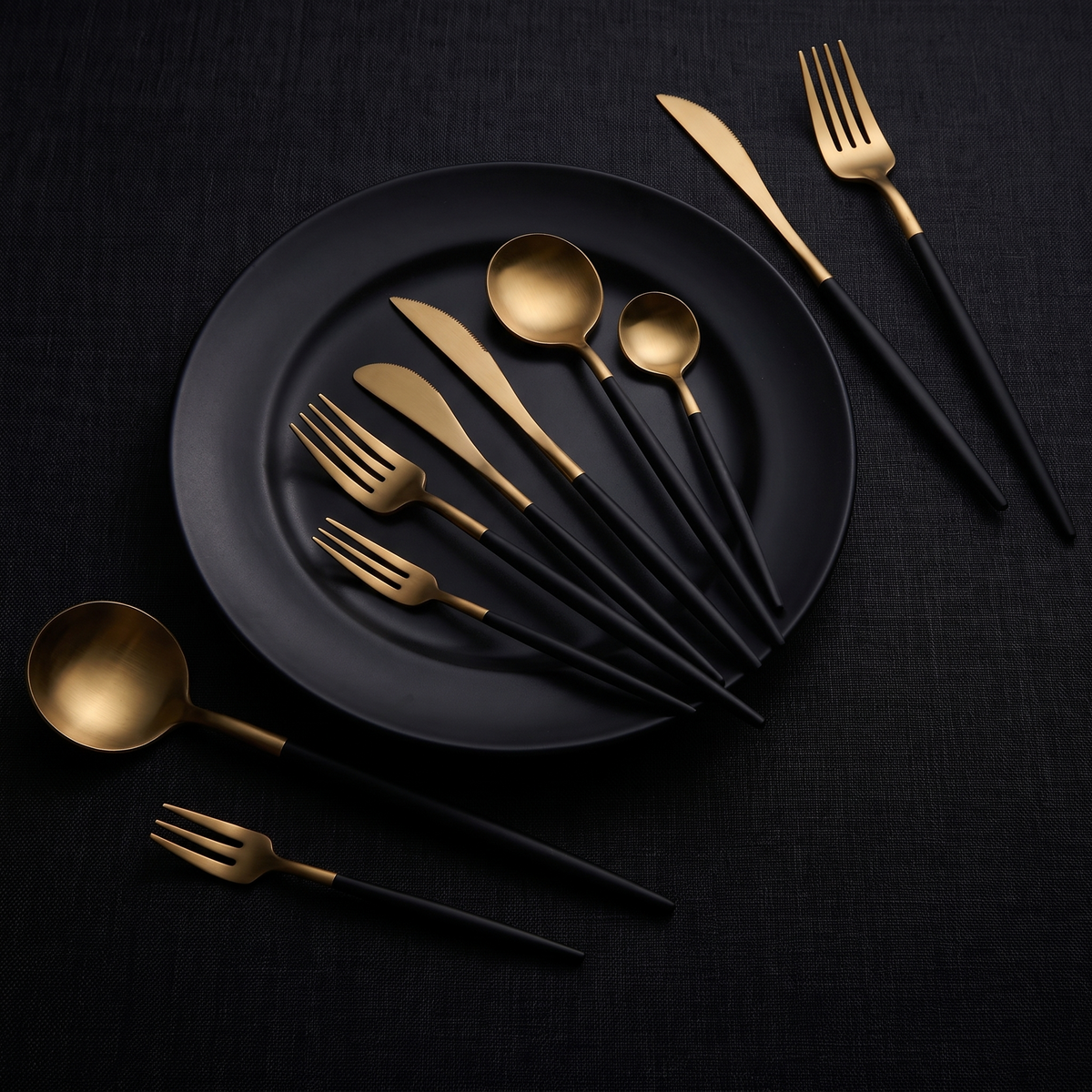 A place setting on matte black porcelain