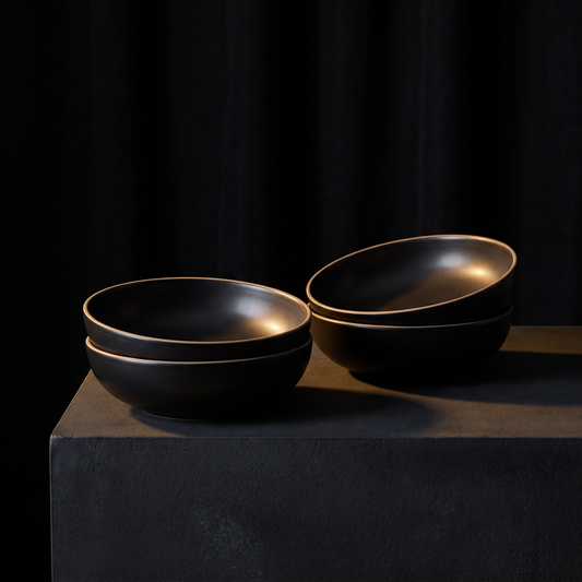 Four noir glaze coupes, stacked in pairs